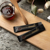 Manuka Honey MGO 300+ satches on the chopping board