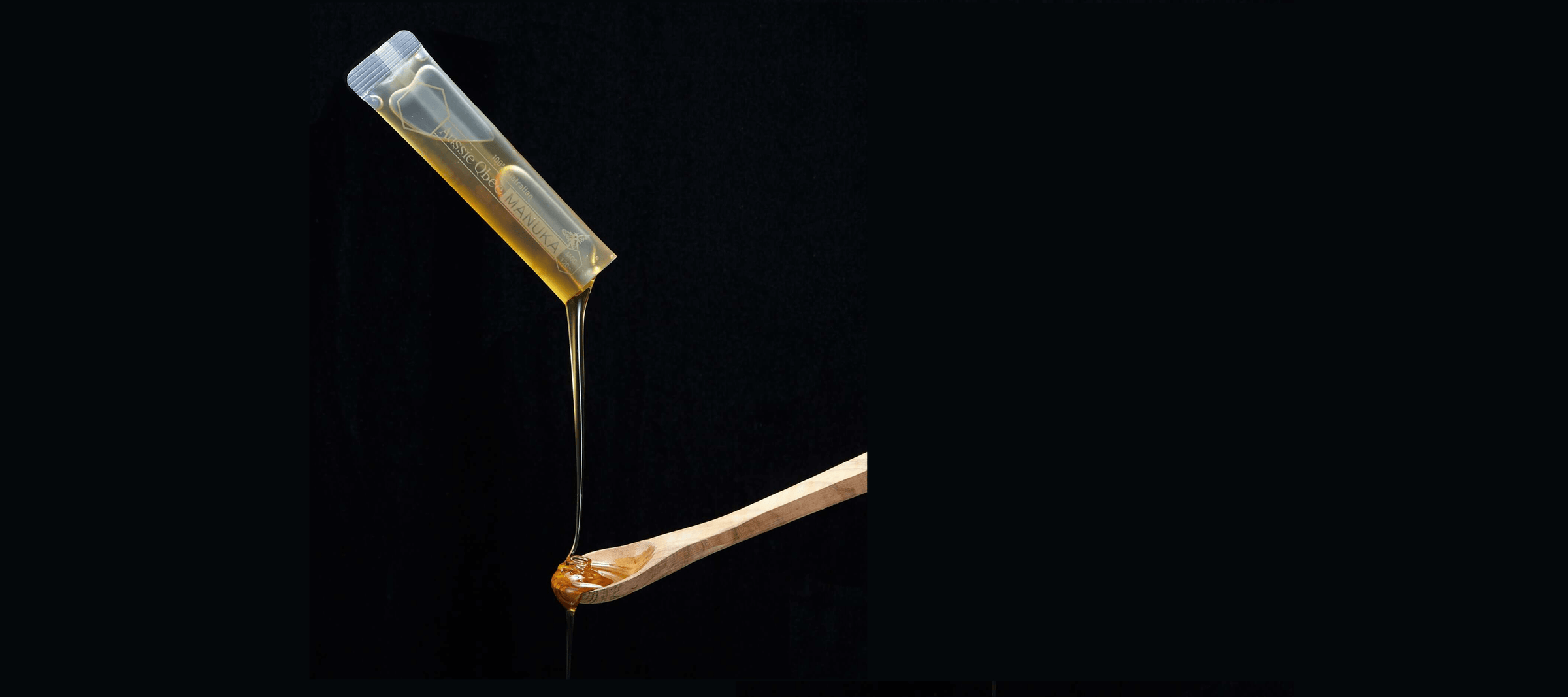 Butter stick with a drizzle of butter on a black background